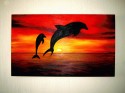 Delfines al atardecer